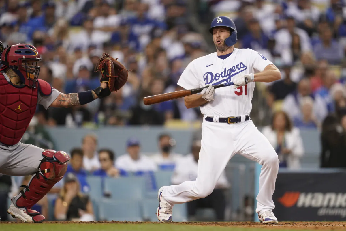 Los Angeles Dodgers' Max Scherzer reacts to a close pitch as he attempted to bunt during the third inning of a National League Wild Card playoff baseball game against the St. Louis Cardinals in Los Angeles on Oct. 6, 2021. (AP Photo/Marcio Jose Sanchez)