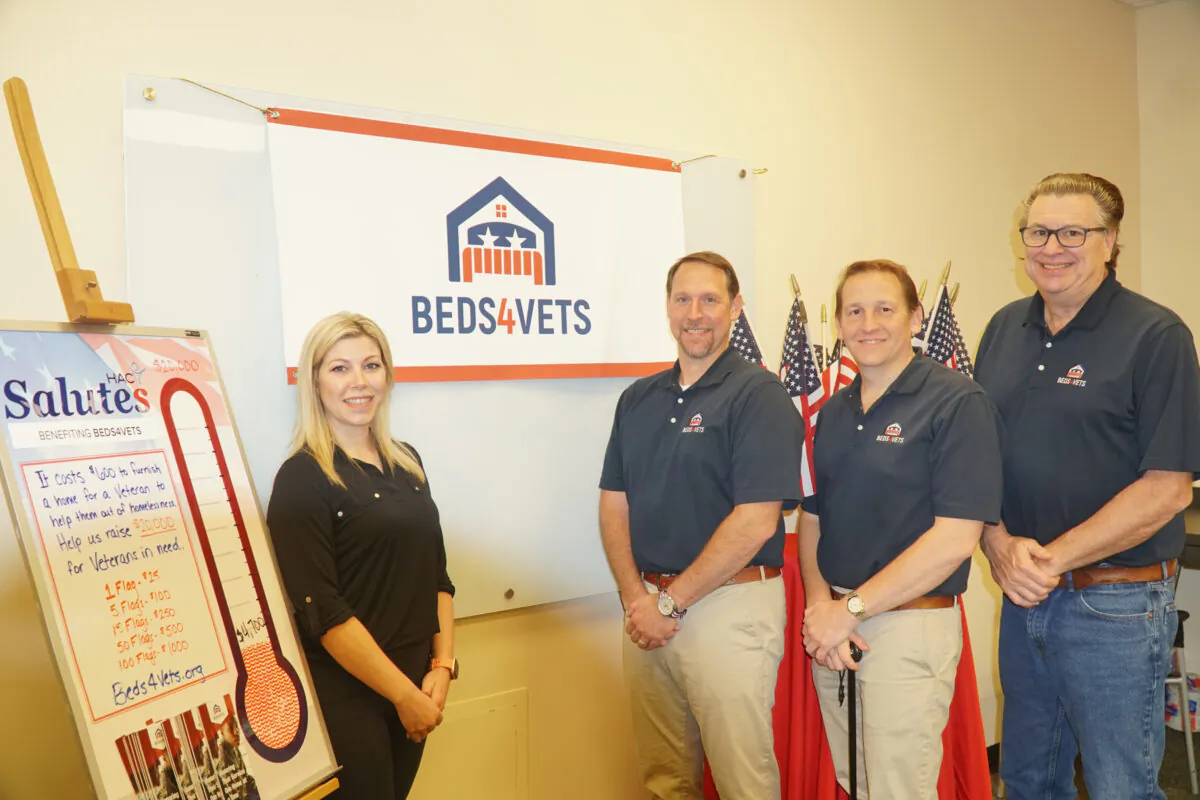 From left: Lisa McGuire from the Hockessin Athletic Club with Christopher Cascio, Zachary Bagdon, and Rick Martin from Beds4Vets. (Lily Sun/The Epoch Times)