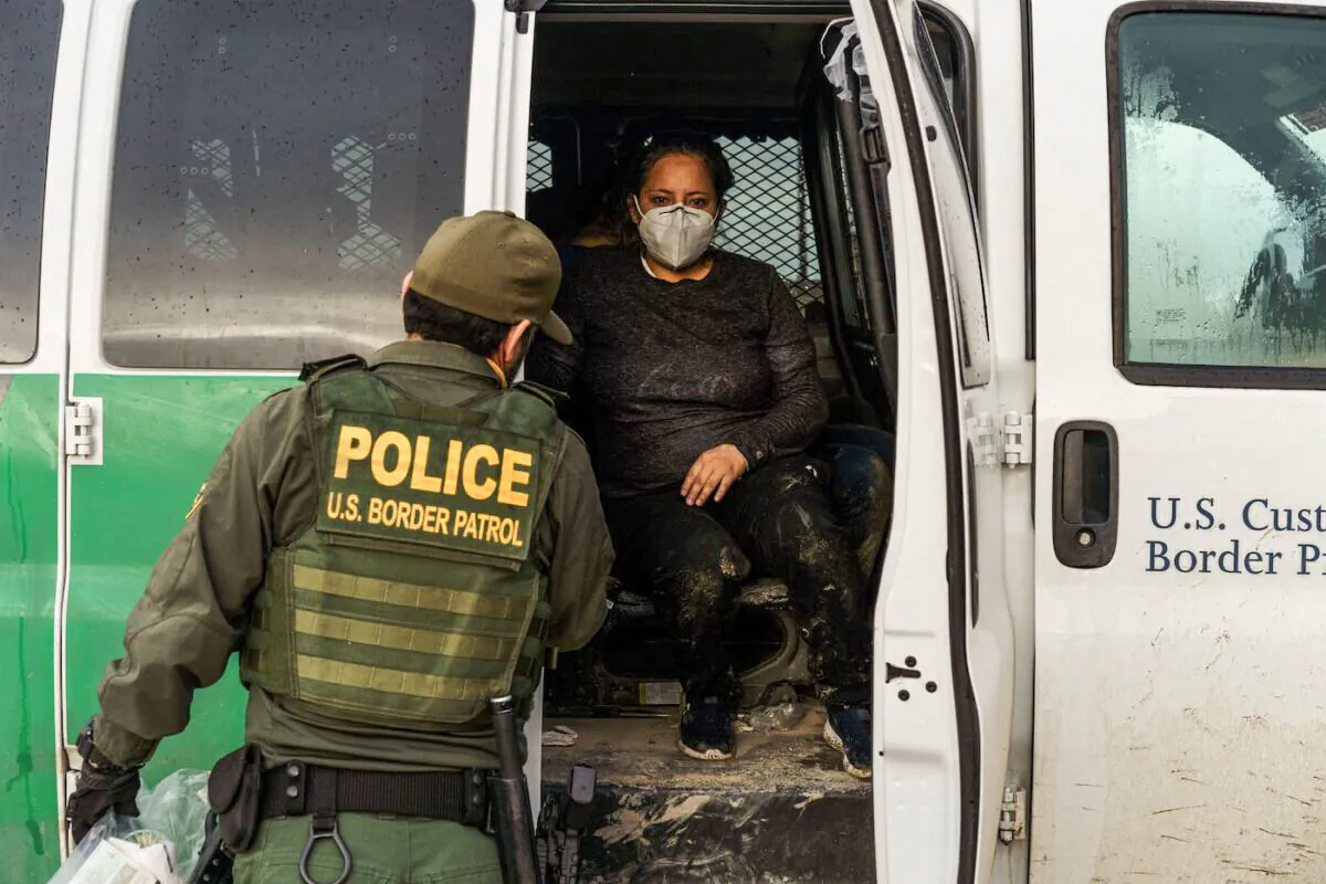 An Ecuadorian woman is pictured in a United States Border Patrol transport vehicle in Sunland Park, New Mexico on Sept.1, 2021. (Paul Ratje/AFP via Getty Images)