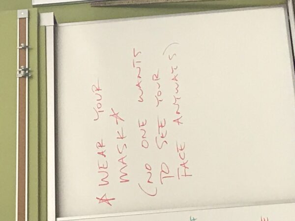 Hand-Written sign made by Laramie High School Physics Teacher Christopher West, posted in his classroom September 2021.