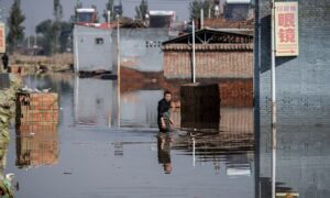 Man-Made Disaster: Flood Victims Fend for Themselves