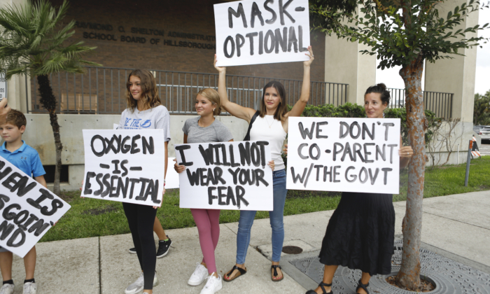 Families protest mask mandates before the Hillsborough County Schools Board meeting held at the district office in Tampa, Fla., on July 27, 2021. (Octavio Jones/Getty Images)