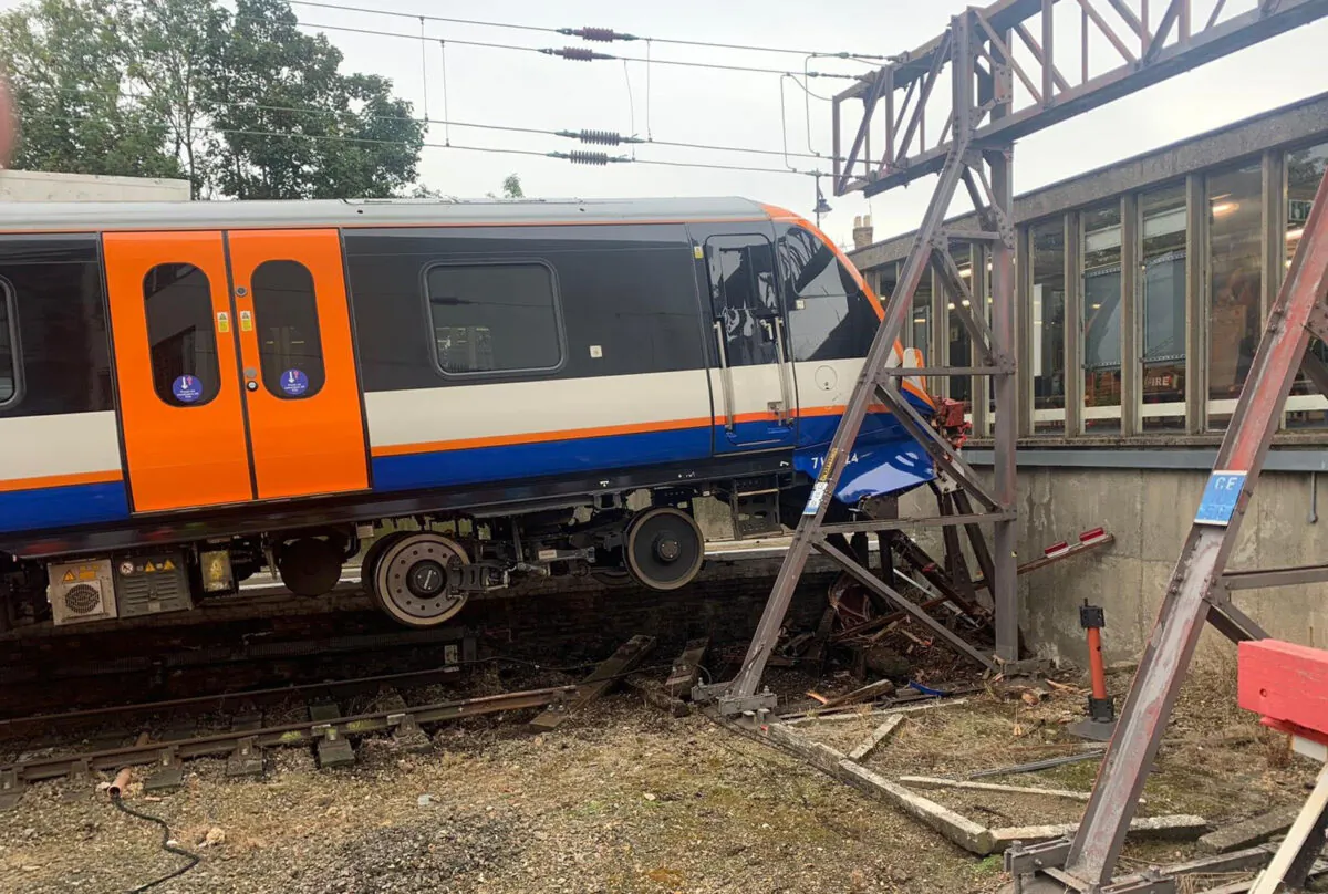 Handout photo issued by London Fire Brigade of them attending Enfield Town station, north London, after a London Overground train crashed through buffers injuring two people, on Oct. 12, 2021. (London Fire Brigade/PA)