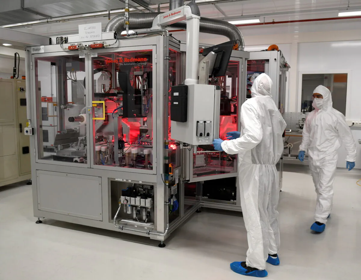 Employees of German carmaker Volkswagen work in a production line of VW's new battery plant in Salzgitter, Germany, on Sept. 23, 2019. (Fabian Bimmer/Reuters)