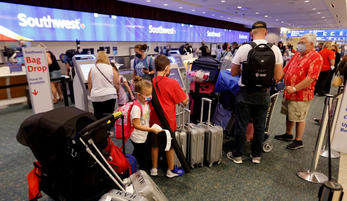 Passengers check in for a Southwest Airlines flight at Orlando International Airport in Orlando, Fla., on Oct. 11, 2021. (Joe Skipper/Reuters)