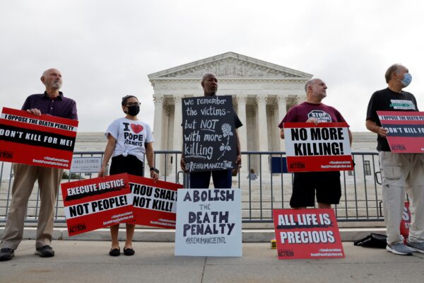 Demonstrators rally against the death penalty at the U.S. Supreme Court during arguments in the Tsarnaev case in Washington