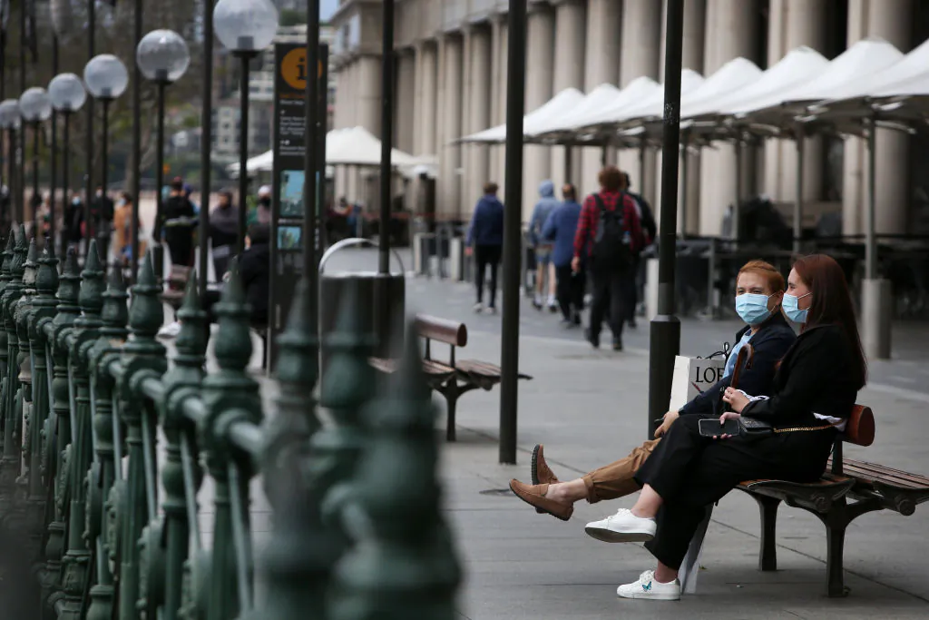 People take in the harbour view at Circular Quay in Sydney, Australia, on Oct. 12, 2021. (Lisa Maree Williams/Getty Images)