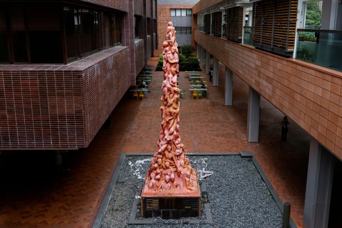 The eight-meter-high (26-foot-high) "Pillar of Shame" by Danish sculptor Jens Galschiot to pay tribute to the victims of the Tiananmen Square massacre in Beijing on June 4, 1989, is seen before it is set to be removed at the University of Hong Kong (HKU) in Hong Kong, China, on Oct. 12, 2021. (Tyrone Siu/Reuters)
