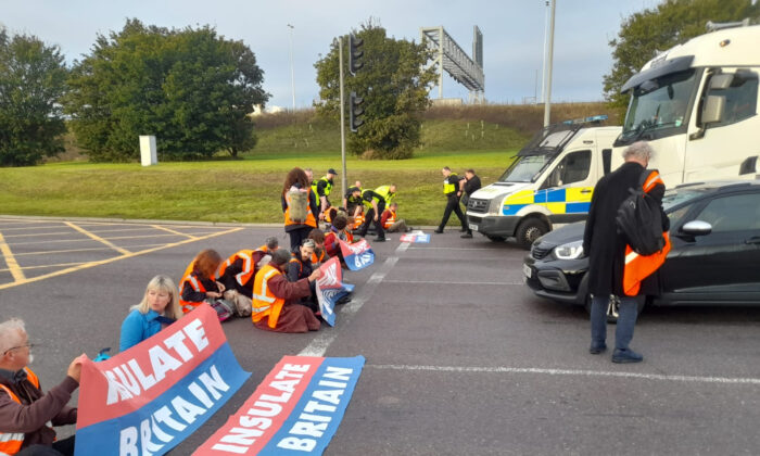 Protesters from Insulate Britain block the M25 at junction 31, near to the Dartford Crossing in Thurrock, Essex, on Oct. 13, 2021. (Insulate Britain/PA)