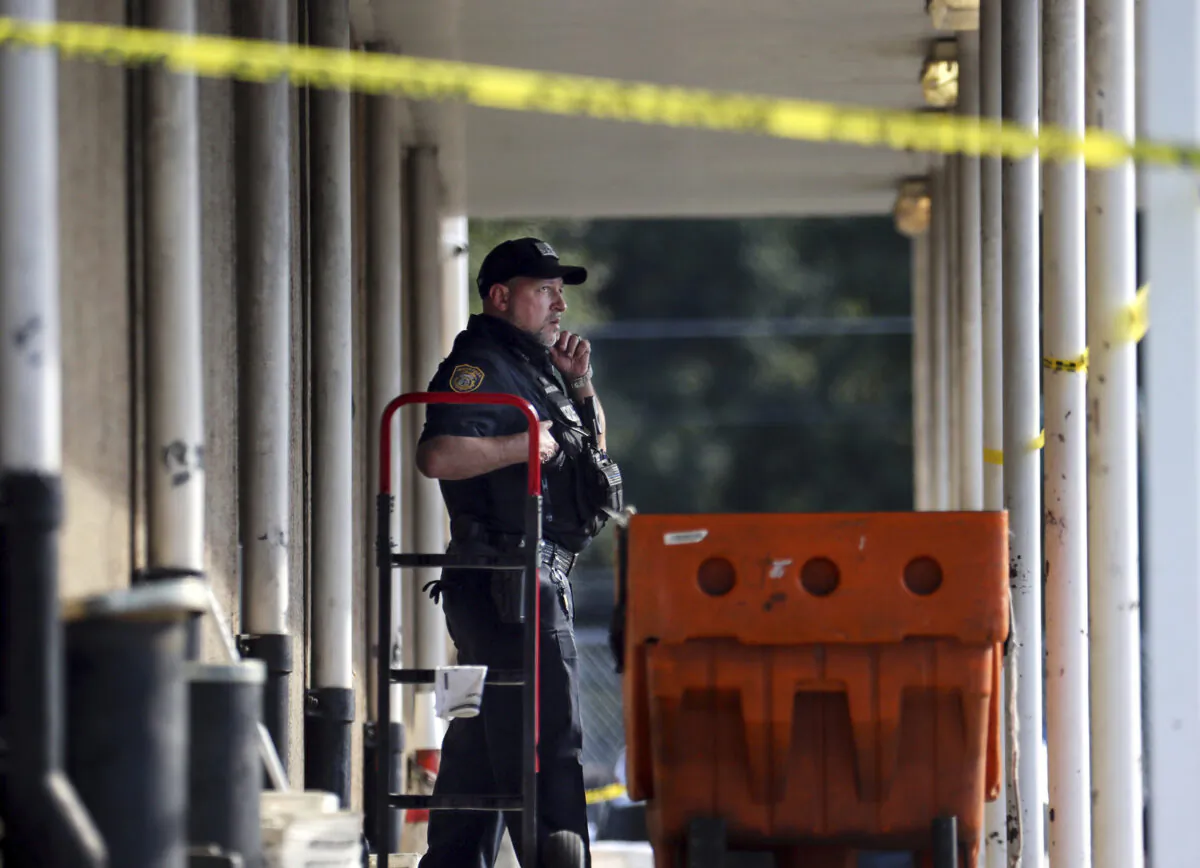 Memphis Police Department officers work the scene of a post office after a shooting, in the Orange Mound neighborhood of Memphis, Tenn., on Oct. 12, 2021. (Patrick Lantrip/Daily Memphian via AP)