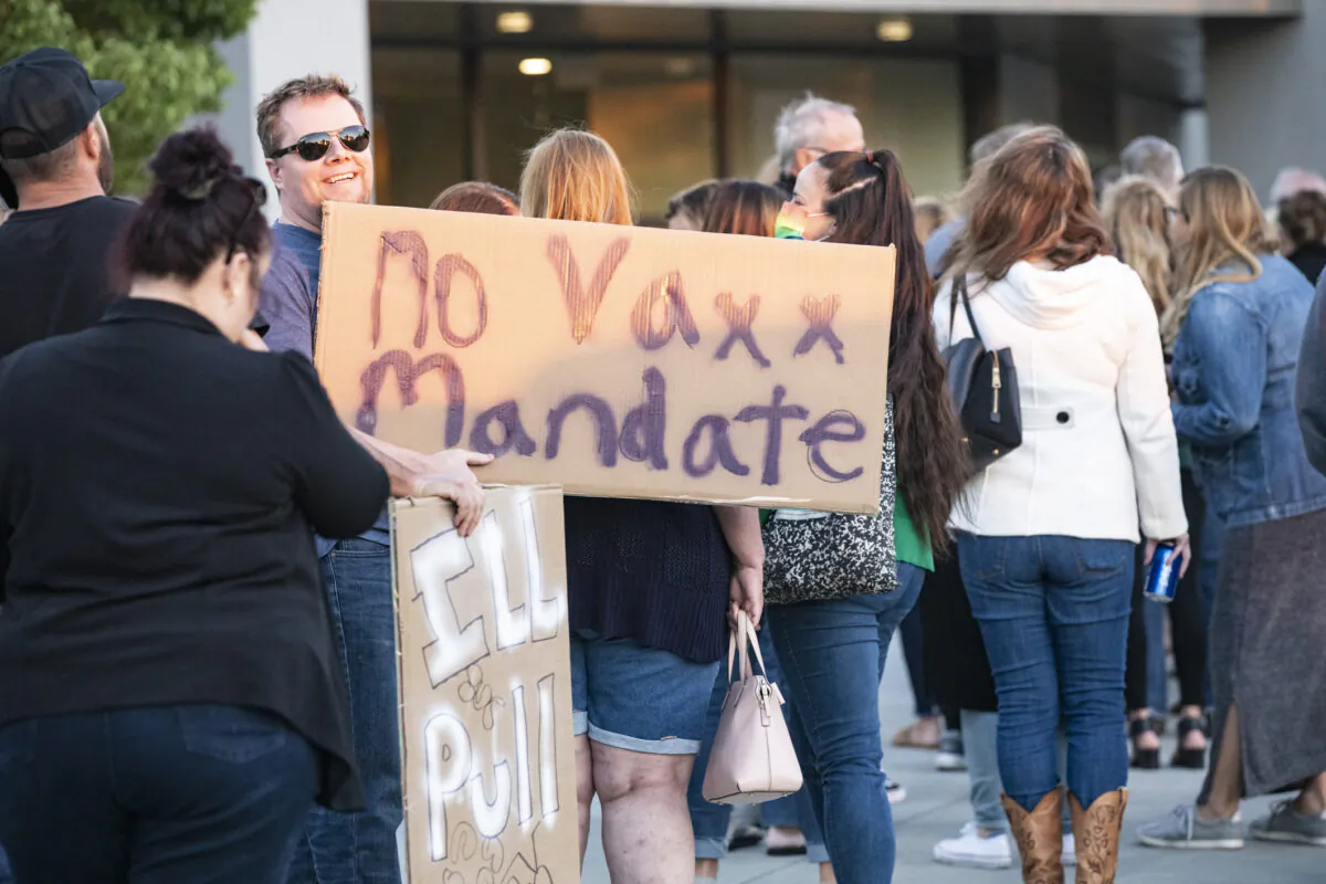 In this file photo, parents gather to express their concerns over vaccine mandates for students at the Placentia Yorba Linda Unified School District building in Placentia, Calif., on Oct. 12, 2021. (John Fredricks/The Epoch Times)