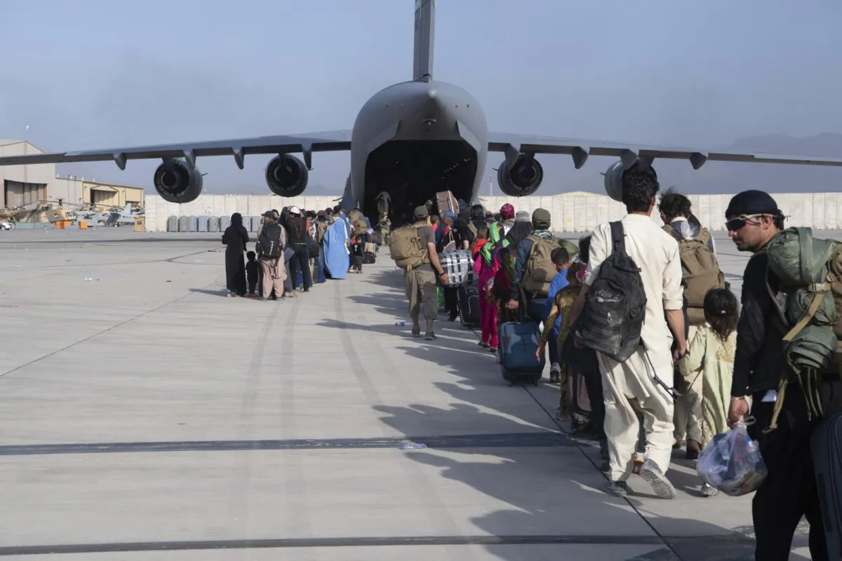 People being evacuated from Afghanistan onto a U.S. Air Force C-17 Globemaster III at Hamid Karzai International Airport in Kabul, Afghanistan, on Aug. 24, 2021. (Master Sgt. Donald R. Allen/U.S. Air Force via AP)