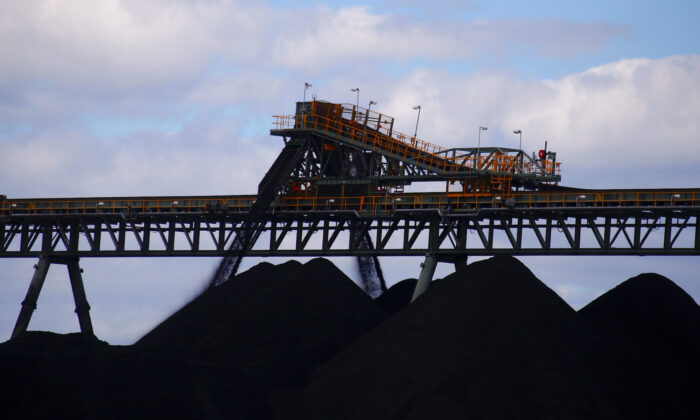 Coal is unloaded onto large piles at the Ulan Coal mines near the central New South Wales rural town of Mudgee in Australia, on March 8, 2018. (David Gray/Reuters)