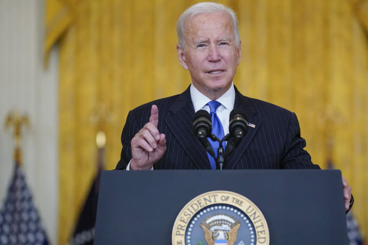 President Joe Biden delivers remarks on efforts to address global supply chain bottlenecks during an event in the East Room of the White House in Washington, on Oct. 13, 2021. (Evan Vucci/AP Photo)