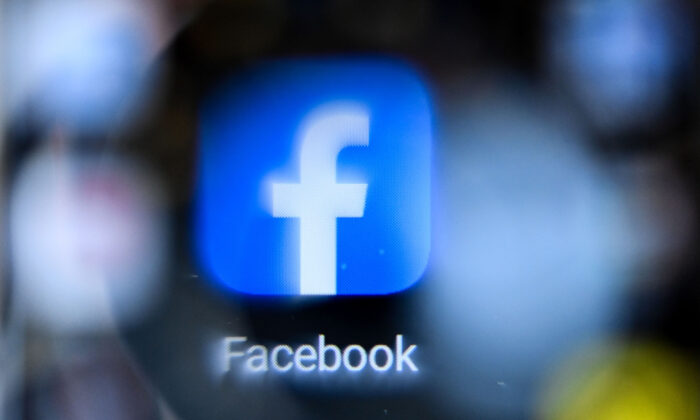 U.S. online social media and social networking service Facebook's logo on a smartphone screen in Moscow on Oct. 12, 2021. (Kirill Kudryavtsev/AFP via Getty Images)