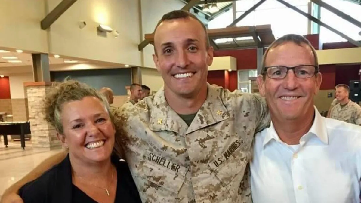 Lt. Col. Stuart Scheller (C) and his parents in a file photograph. (Courtesy of Stuart Scheller)