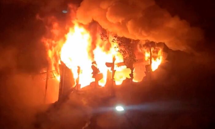 In this image taken from video by Taiwan's EBC, fire and smoke pour out from a building in Kaohsiung, in southern Taiwan on Oct. 14, 2021. (EBC via AP)