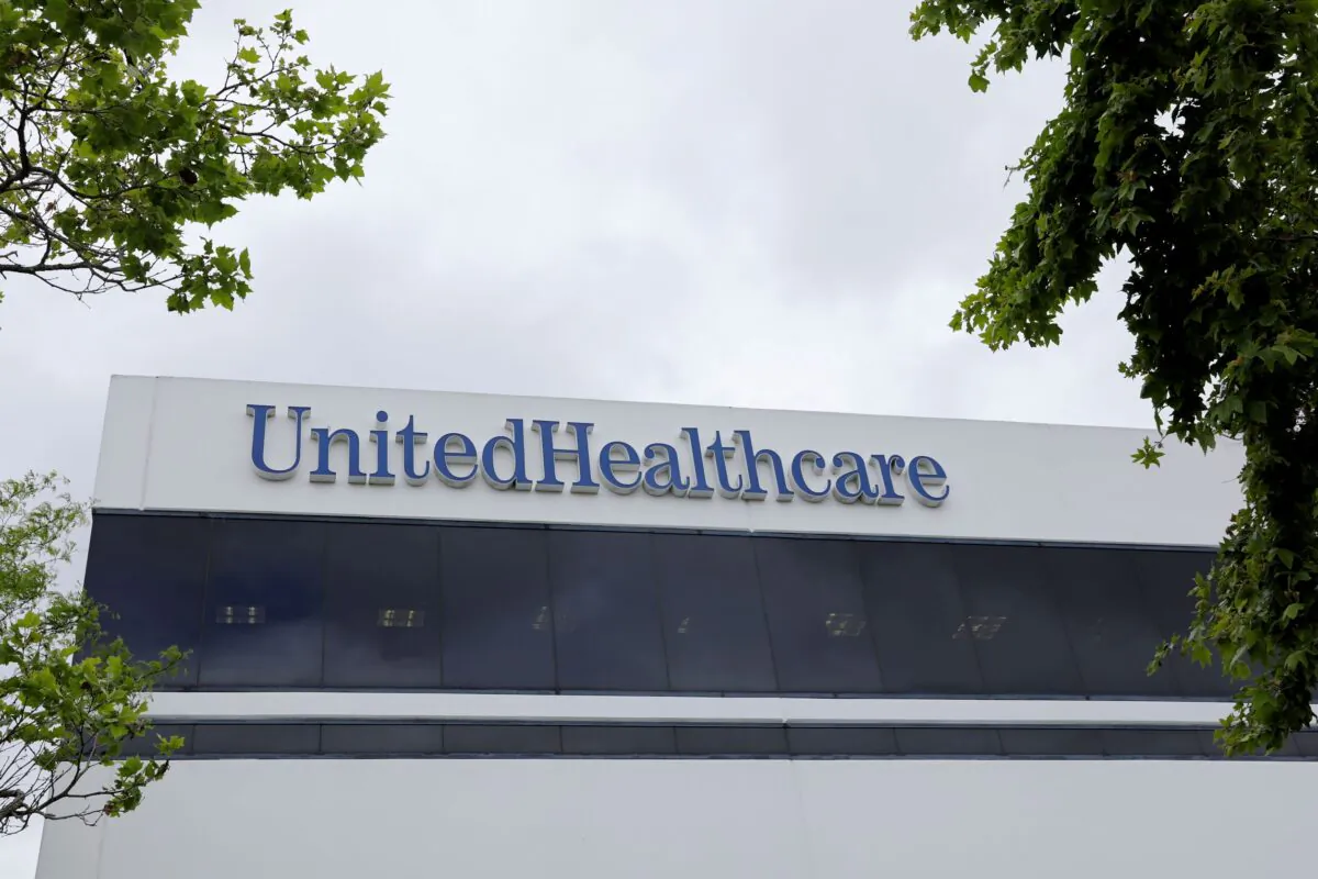 The corporate logo of the UnitedHealth Group appears on the side of one of their office buildings in Santa Ana, Calif., on April 13, 2020. (Mike Blake/Reuters)