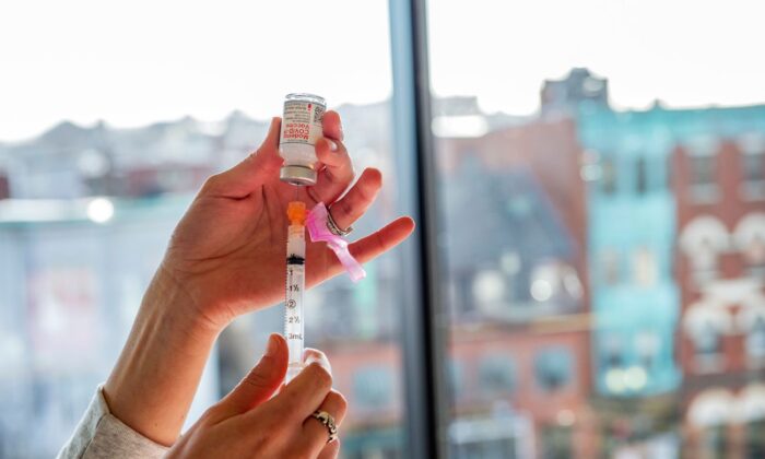 A nurse prepares a syringe with the Moderna vaccine in Boston, Mass., on Dec. 24, 2020. (Joseph Prezioso/AFP via Getty Images)