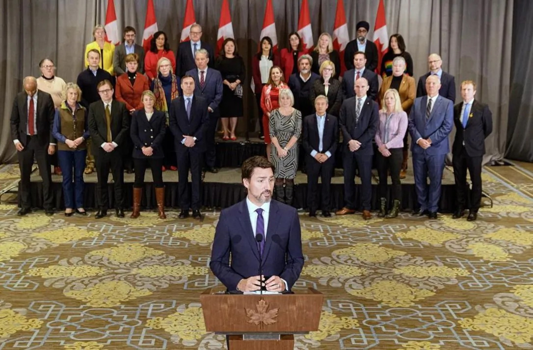 Prime Minister Justin Trudeau stands in front of his cabinet as he speaks to media during the final day of the Liberal cabinet retreat at the Fairmont Hotel in Winnipeg, on Jan. 21, 2020. (The Canadian Press/Mike Sudoma)
