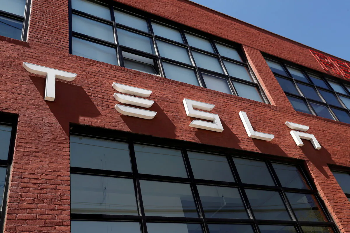 The Tesla logo is seen outside a dealership in the Brooklyn borough of New York on April 26, 2021. (Shannon Stapleton/Reuters)
