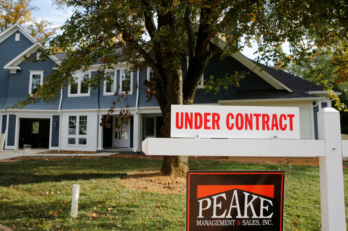 A real estate sign advertising a home "Under Contract" is pictured in Vienna, Virginia, outside of Washington, on Oct. 20, 2014. (Larry Downing/Reuters)