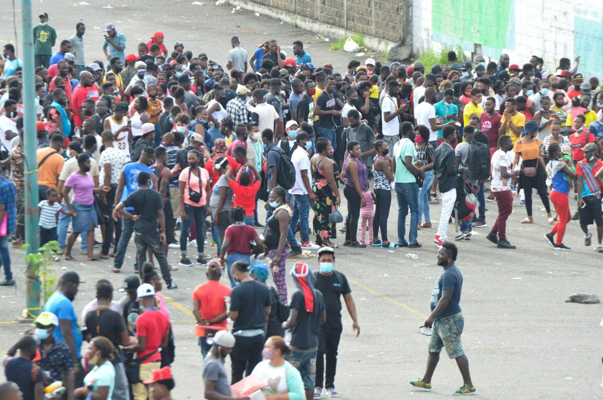 Migrants, mostly Haitians, wait for asylum processing by Mexico's Commission for Refugee Assistance (COMAR) outside a soccer stadium, in Tapachula, Mexico, on Oct. 13, 2021. (Jose Torres/Reuters)