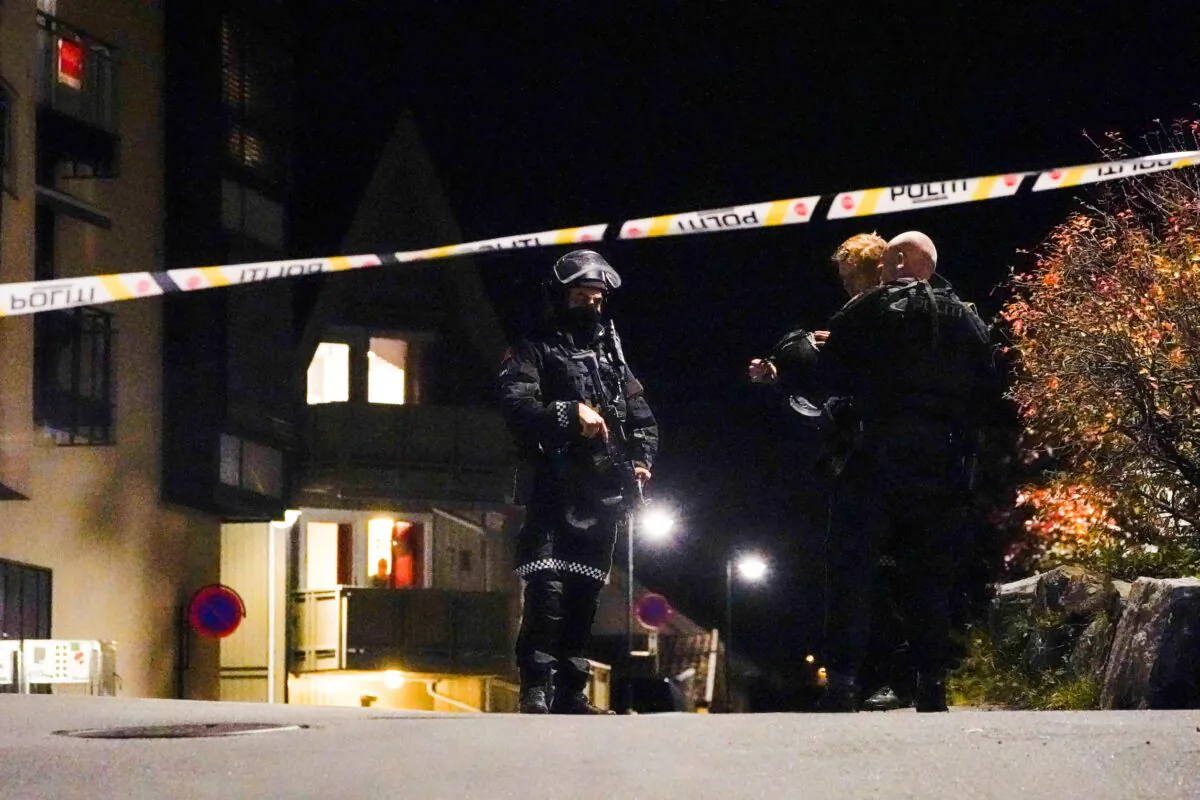 Police officers investigate after several people were killed and others were injured by a man using a bow and arrows to carry out attacks, in Kongsberg, Norway, October 13, 2021. (Hakon Mosvold/NTB/via Reuters)