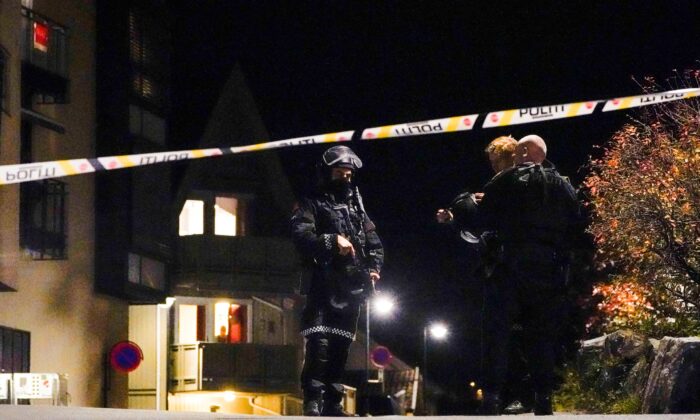 Police officers investigate after several people were killed and others were injured by a man using a bow and arrows to carry out attacks, in Kongsberg, Norway, October 13, 2021. (Hakon Mosvold/NTB/via Reuters)