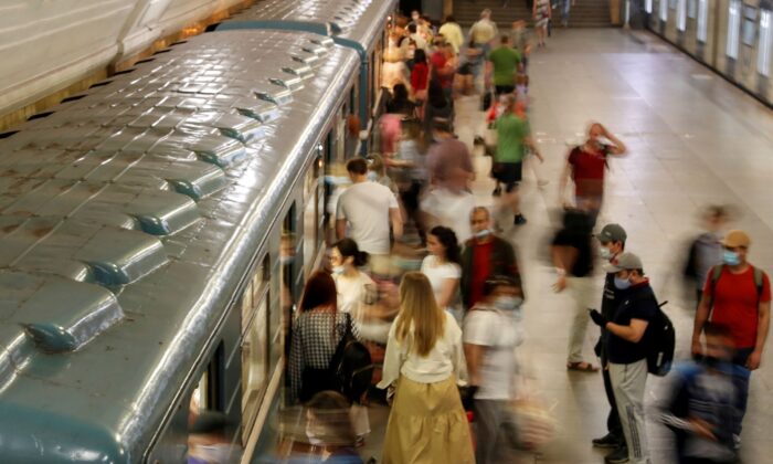 Passengers are seen astatine  a metro presumption    connected  the archetypal  time  aft  a lockdown designed to curb the dispersed  of COVID-19 was lifted successful  Moscow, Russia, connected  June 9, 2020. (Shamil Zhumatov/Reuters)