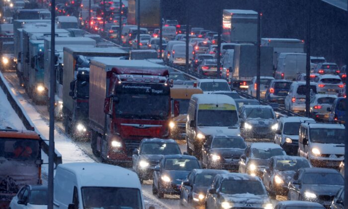 Cars are pictured astatine  unreserved  hr  postulation   connected  A100 road  during a snowfall successful  Berlin, Germany connected  Feb. 8, 2021. (Fabrizio Bensch/Reuters)