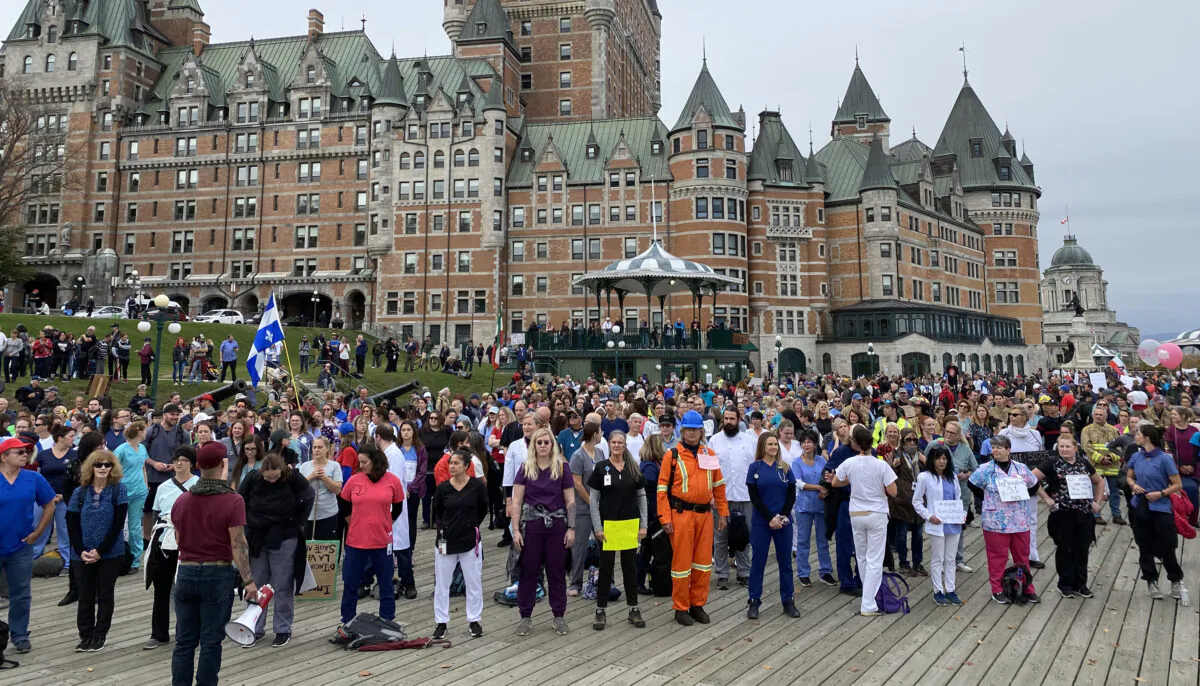 Frontline workers and first responders stand in silence to protest Quebec's vaccine mandate in Quebec City on Oct. 15, 2021. (The Epoch Times/Sonia Rouleau)
