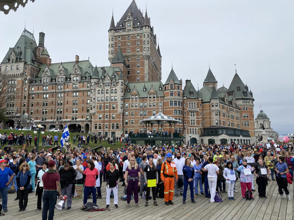Front-line workers and first responders gather in front of Château Frontenac to protest Quebec's vaccine mandates, in Quebec City, on Oct. 15, 2021. (Sonia Rouleau/The Epoch Times)
