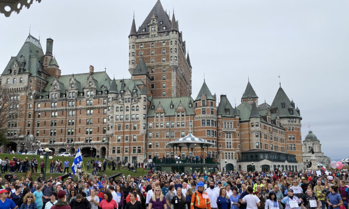 Front-line workers and first responders gather in front of Château Frontenac to protest Quebec's vaccine mandates, in Quebec City, on Oct. 15, 2021. (Sonia Rouleau/The Epoch Times)