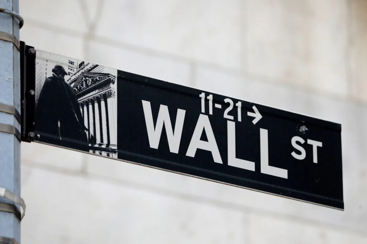 A street sign for Wall Street is seen outside of the New York Stock Exchange (NYSE) in New York City, N.Y., on June 28, 2021. (Andrew Kelly/Reuters)