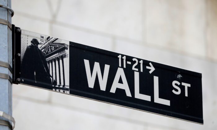 A street sign for Wall Street is seen outside of the New York Stock Exchange (NYSE) in New York City, N.Y., on June 28, 2021. (Andrew Kelly/Reuters)