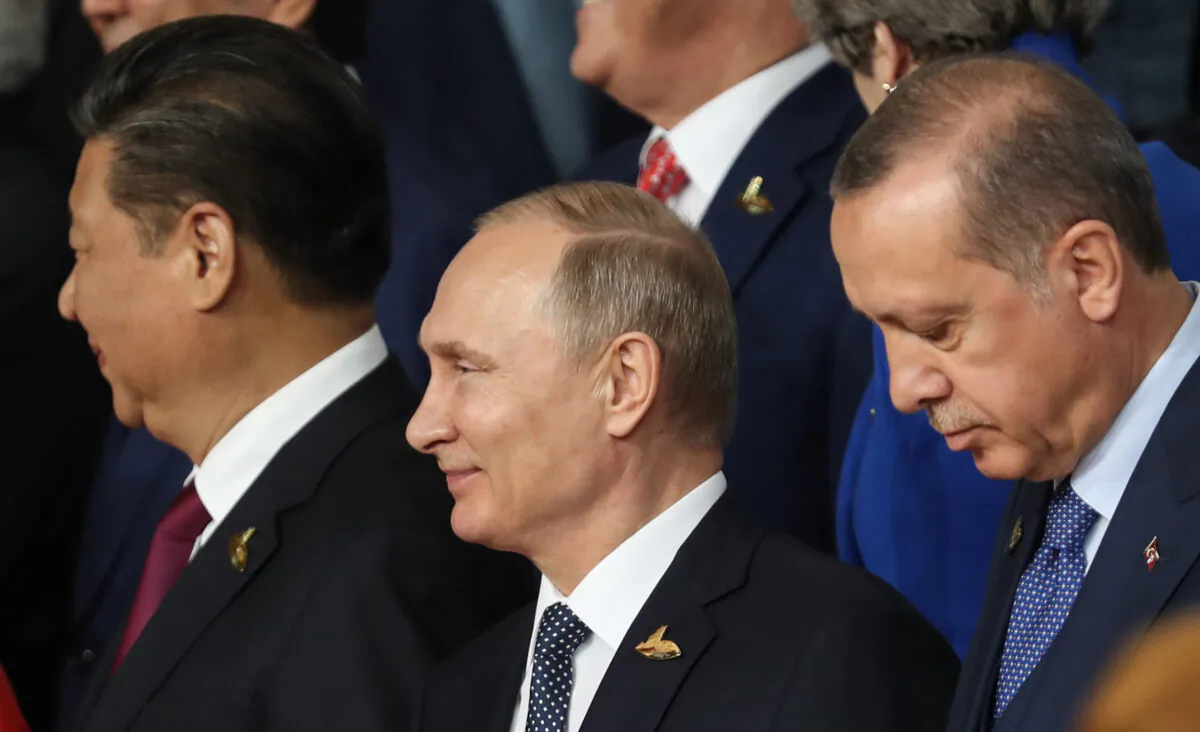 Chinese leader Xi Jinping, Russian President Vladimir Putin and Turkish President Recep Tayyip Erdogan attend the G20 summit  in Hamburg, Germany, on July 7, 2017. (Matt Cardy/Getty Images)