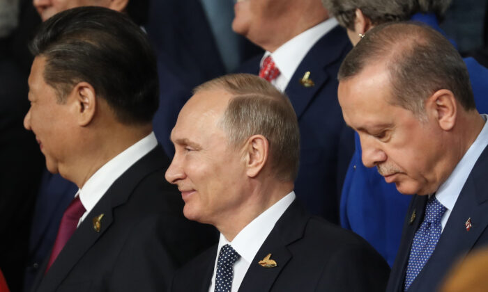 (Left to right) Chinese leader Xi Jinping, Russian President Vladimir Putin, and Turkish President Recep Tayyip Erdogan attend the G20 summit  in Hamburg, Germany, on July 7, 2017. (Matt Cardy/Getty Images)