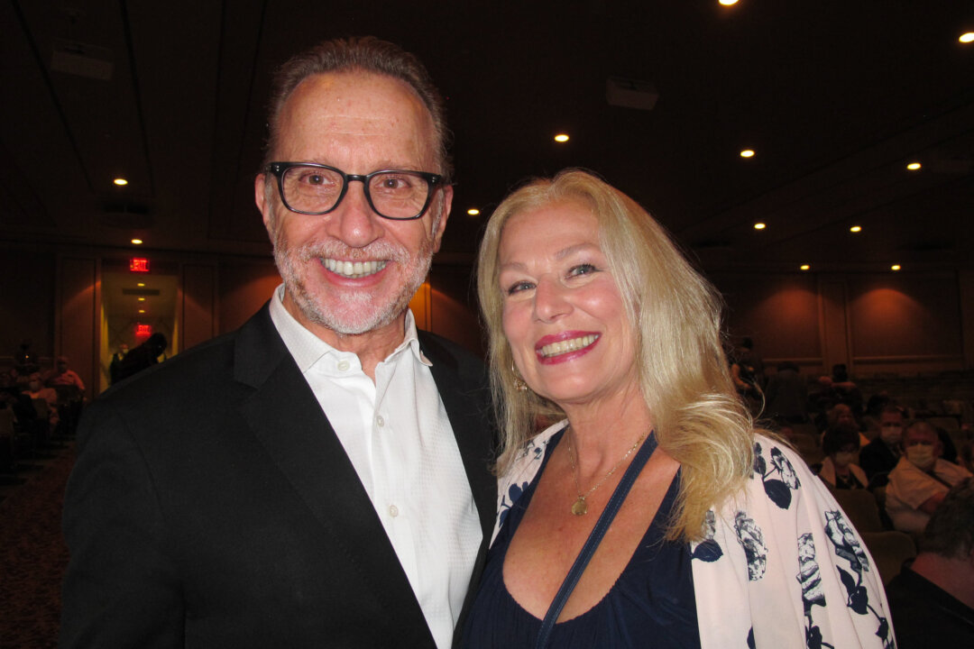 Richard Pelland and Janet Lizotte attend Shen Yun Performing Arts at The Hanover Theatre in Worcester, Mass., on Oct. 16, 2021. (Mary Mann/The Epoch Times)