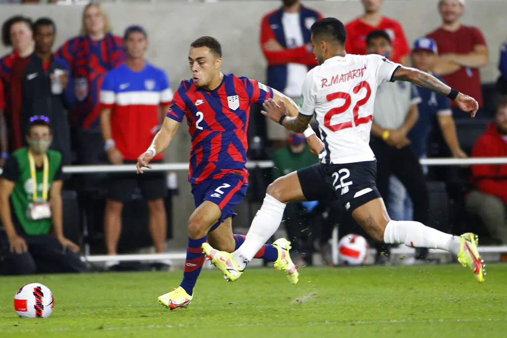 United States' Sergino Dest, left, dribbles the ball upfield as Costa Rica's Ronald Matarrita defends during the first half of a World Cup qualifying soccer match Wednesday, Oct. 13, 2021, in Columbus, Ohio. (AP Photo/Jay LaPrete)