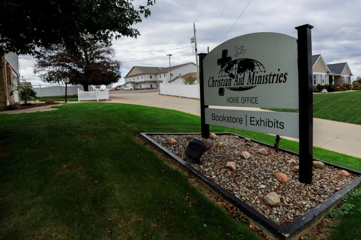 A sign marks the entrance of the home office of Christian Aid Ministries in Millersburg, Ohio, on Oct. 17, 2021. (Reuters/Aaron Josefczyk)