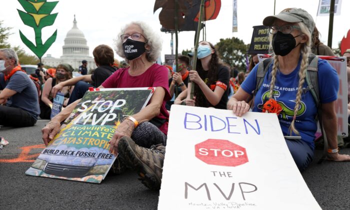 Climate activists during a protest on Capitol Hill in Washington on Oct. 15, 2021. (Alex Wong/Getty Images)