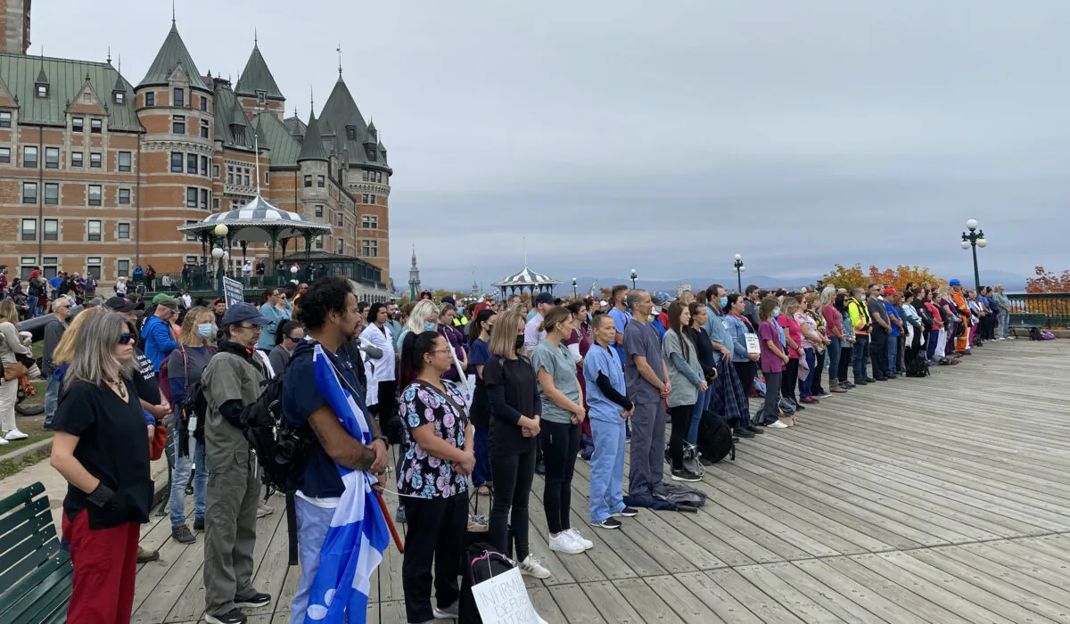 Front-line workers and first responders gather in front of Château Frontenac to protest Quebec's vaccine mandate, in Quebec City on Oct. 15, 2021. (Sonia Rouleau/The Epoch Times)