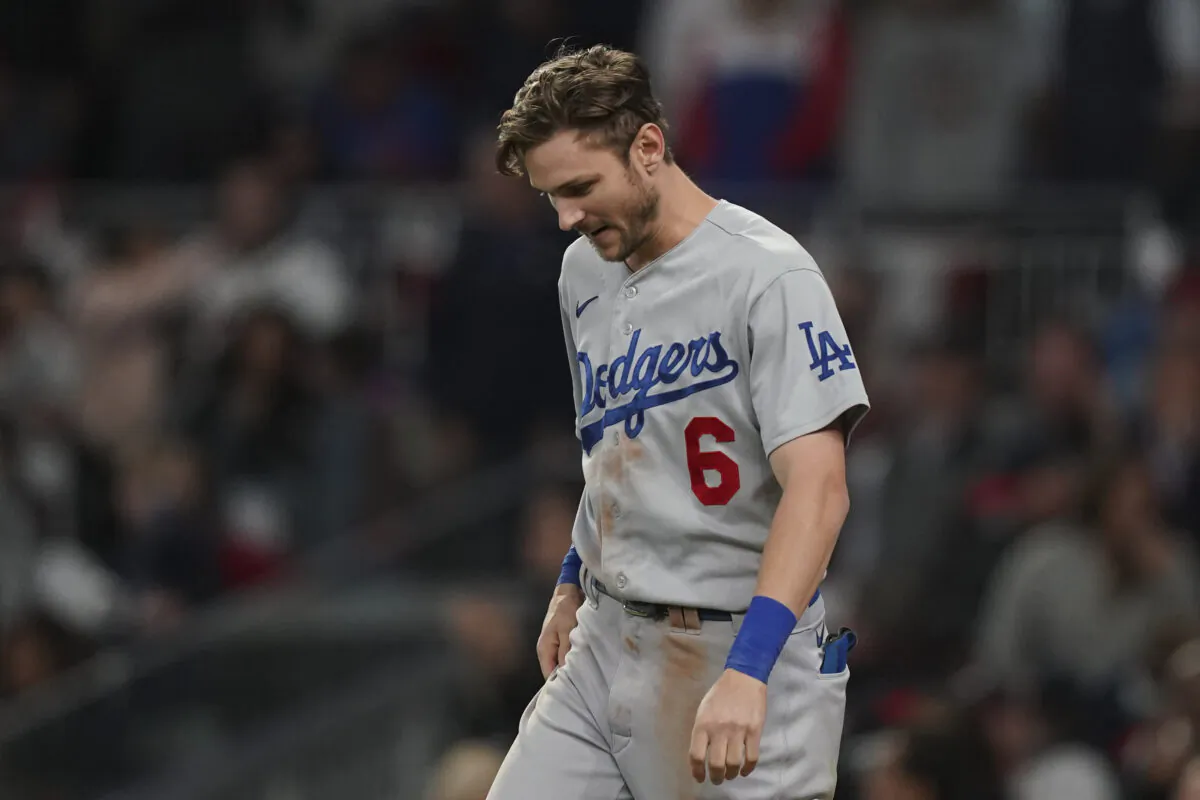 Los Angeles Dodgers' Trea Turner reacts after striking out in the seventh inning against the Atlanta Braves in Game 1 of baseball's National League Championship Series in Atlanta on Oct. 16, 2021. (AP Photo/Brynn Anderson)