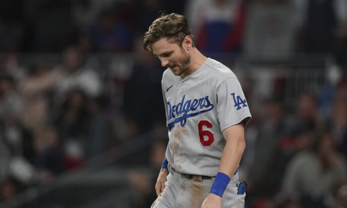 Los Angeles Dodgers' Trea Turner reacts after striking out in the seventh inning against the Atlanta Braves in Game 1 of baseball's National League Championship Series in Atlanta on Oct. 16, 2021. (AP Photo/Brynn Anderson)