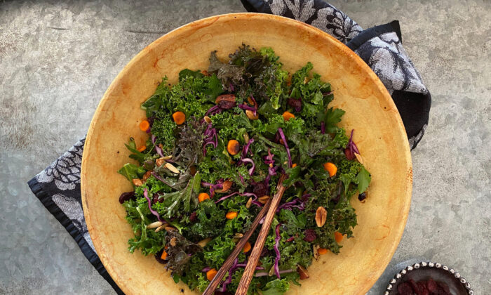 Massaged kale mingles with almonds, dried cranberries, and pumpkin seeds, all bound together by a robust balsamic vinaigrette. (Lynda Balslev for Tastefood)