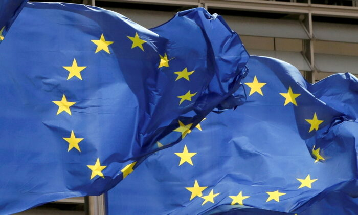 European Union flags flutter outside the EU Commission headquarters in Brussels, Belgium, on May 5, 2021. (Yves Herman/Reuters)