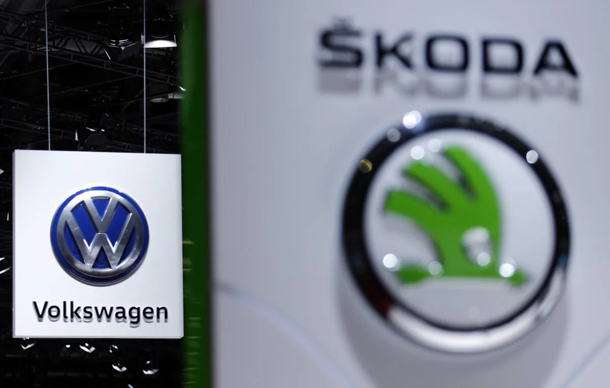 A Volkswagen logo is pictured next to a logo of Skoda during the second media day of the 86th International Motor Show in Geneva, Switzerland, on March 2, 2016. (Denis Balibouse/Reuters)