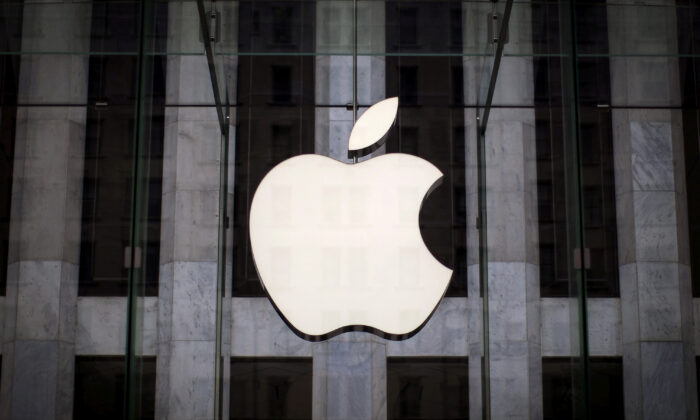An Apple logo hangs above the entrance to the Apple store on 5th Avenue in the Manhattan borough of New York City on July 21, 2015. (Mike Segar/Reuters)
