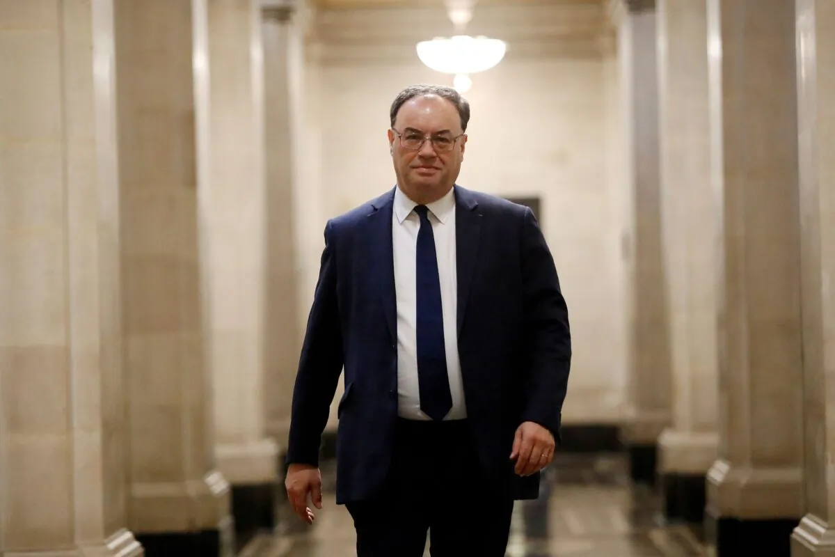 Bank of England Governor Andrew Bailey poses for a photograph on the first day of his new role at the Central Bank in London, Britain, on March 16, 2020. (Tolga Akmen/Pool via Reuters)